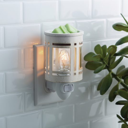 Mission Style Wall-mounted night light with a plant on a white tiled wall