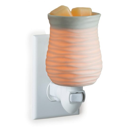 Wax warmer with a ribbed design on a white background